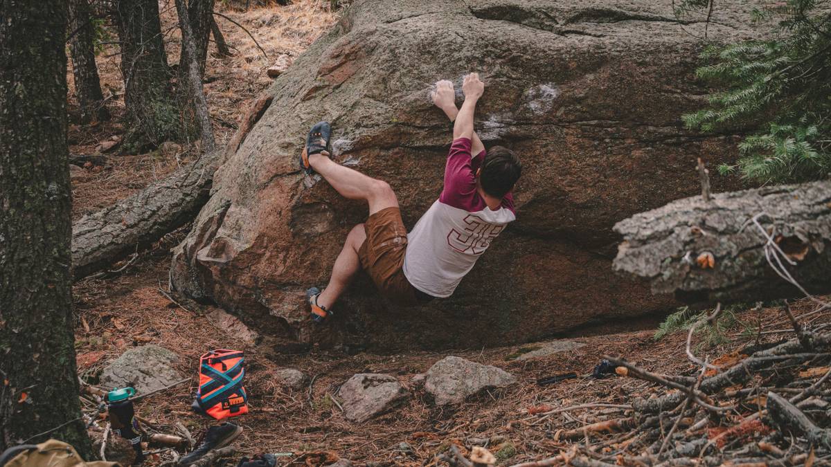 Climber using hand health monitoring tools with sensor-equipped gloves