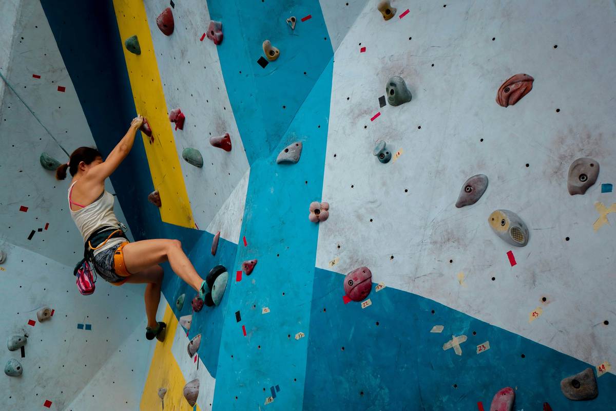 Climber using Climb Safety Apps on smartphone mid-route for anchor verification